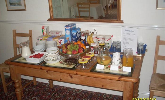 Help yourself to anything on this table while your tea/coffee and toast is prepared.  Once you are seated then order your cooked breakfast which will